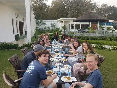 Guests enjoying a meal together in the garden at DTR Jungle Hideaways